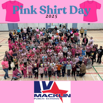 Group of children and adults wearing pink.